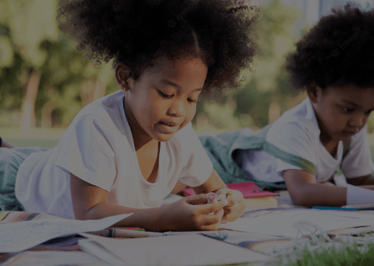 Young african american boy writing