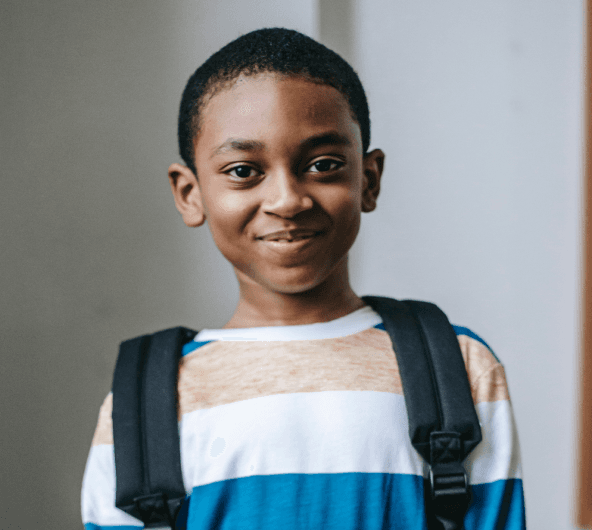 Young african american boy writing