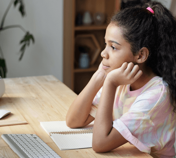 Young african american boy writing