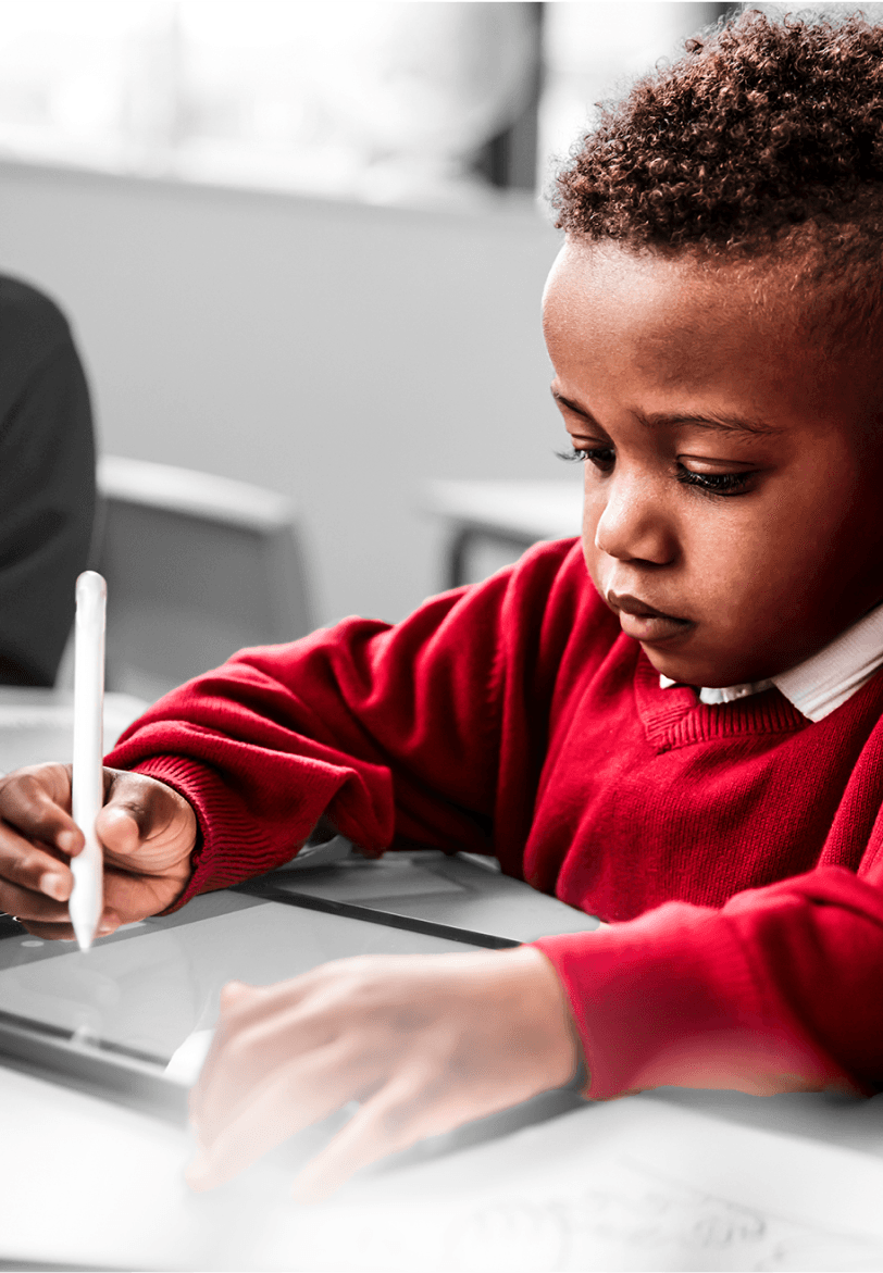 Young african american boy writing