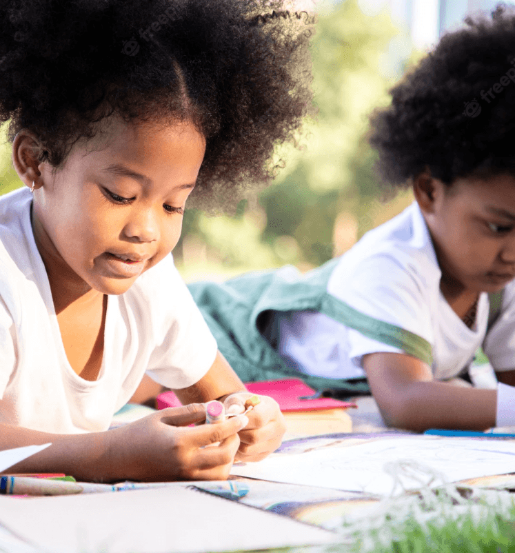 Young african american boy writing